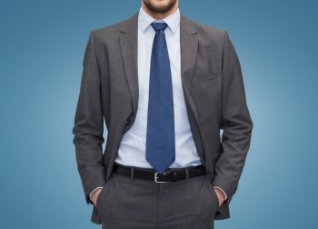 business, people and office concept - close up of businessman over blue background