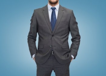 business, people and office concept - close up of businessman over blue background