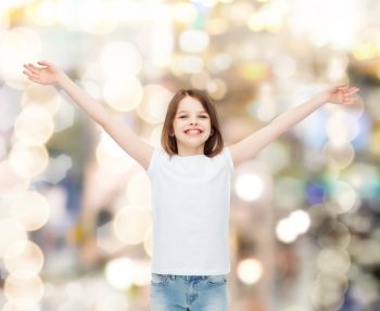 advertising, childhood, gesture and people - smiling little girl in white blank t-shirt with stretched out arms over holidays background