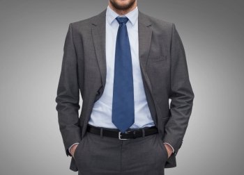 business, people and office concept - close up of businessman over gray background