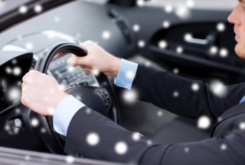 transportation, people and vehicle concept - close up of businessman driving car