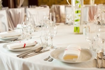 White beautiful table set for a wedding dinner