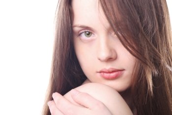 Young attractive woman’s face with long haiar isolated