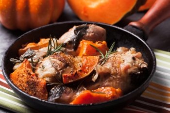 Chicken with pumpkin baked in frying pan