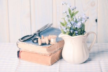 Vintage still life with forget-me-not in a jug