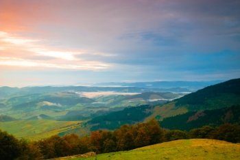 Sunrise in misty morning and village view from Carpathian mountains. Sunrise in misty morning 
