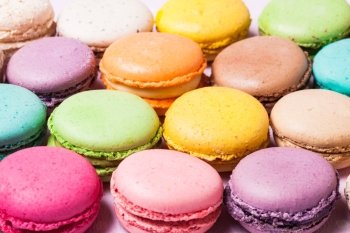Colorful macaroons - french dessert as a background. The colorful macaroons 