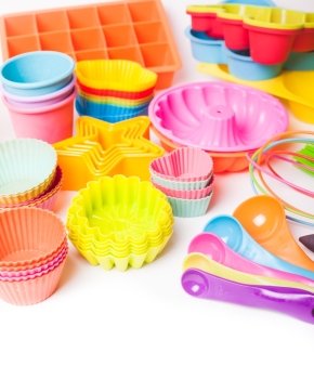 Rainbow silicone confectionery utensils on a white background.  Rainbow silicone confectionery utensils