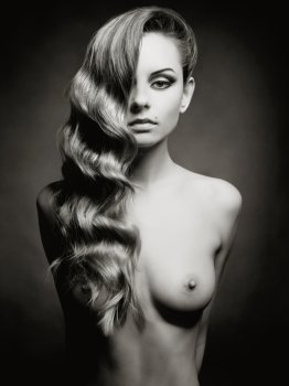 Fashion portrait of nude elegant lady on black background