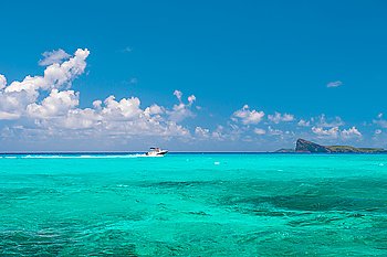 Turquoise sea water and perfect blue sky. Travel background. Nature landscape
