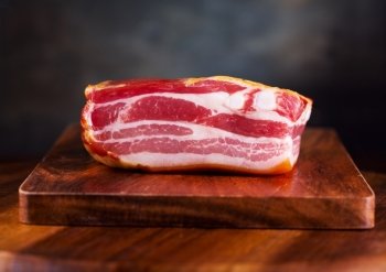 Smoked bacon on wooden table