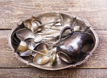 Vintage silverware on wooden background