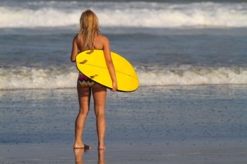 Picture of surfer girl.Bali. Indonesia.