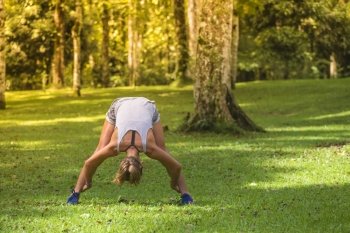 Young woman stretching before Fitness