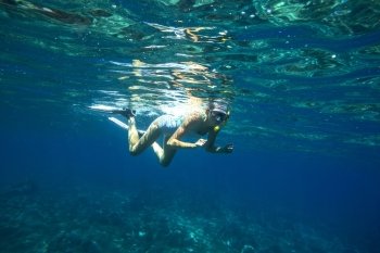 Beautiful women snorkeling in the tropical sea