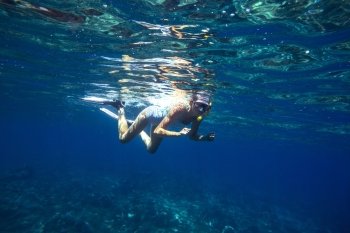 Beautiful women snorkeling in the tropical sea