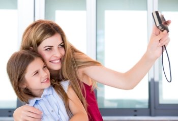 Girl taking a selfie with her mother or sister