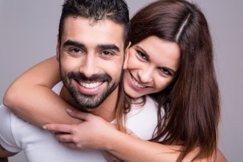 Portrait of a funny love couple hugging each other