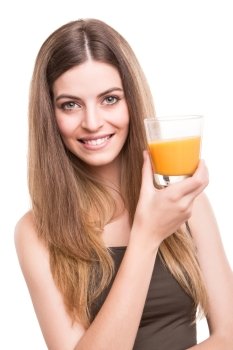 Blonde girl drinking orange juice over white