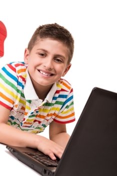 Cute blond boy using a personal computer