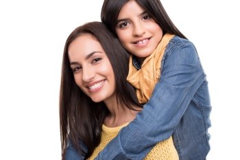 Woman and little girl hugging each other - Family concept