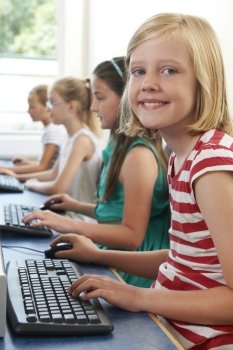 Group Of Female Elementary School Children In Computer Class