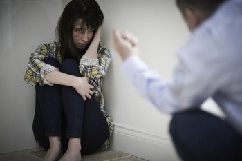 Victime Of Domestic Abuse Being Threatened By Man