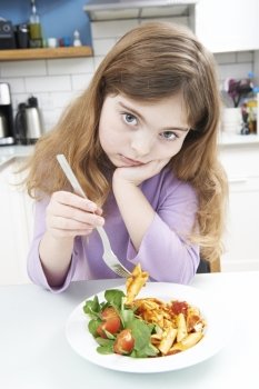 Portrait Of Girl Not Enjoying Healthy Meal At Home