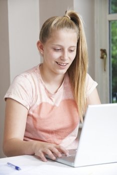 Girl Using Laptop At Home