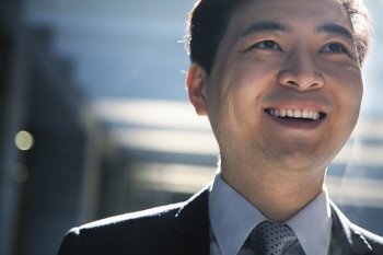Portrait of smiling businessman in a parking garage