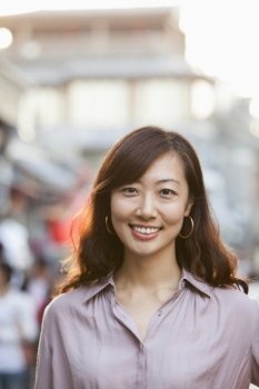 Portrait Of Smiling Mid Adult Woman In Houhai, Beijing