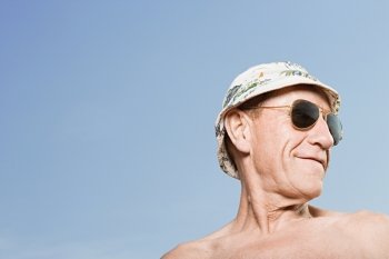 Man wearing sunhat and sunglasses