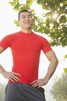Young Muscular Man Standing and Smiling