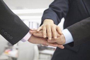 Pile of Three Business People Hands Together