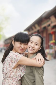 two young woman embracing