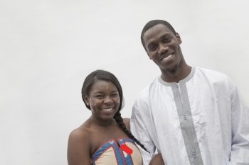 Portrait of young couple in traditional African clothing, studio shot  