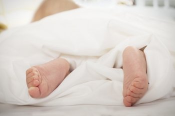Close-up of baby’s feet in the blanket