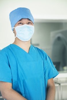 Portrait of young surgeon wearing surgical mask in the operating room