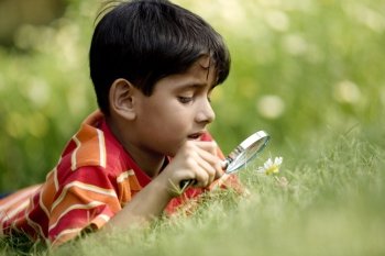 Boy with a magnifying glass 