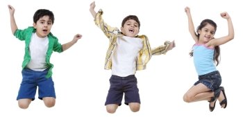 Happy children jumping over white background 
