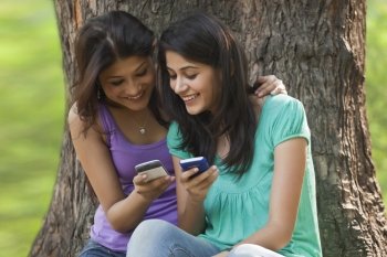 Young women using cell phone 