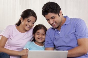 Happy family using laptop 