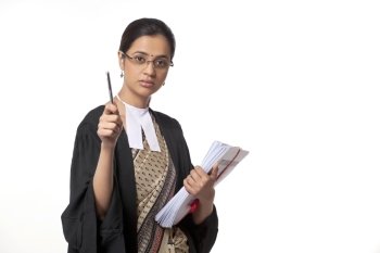 Portrait of young female lawyer holding pen and documents isolated over white background 