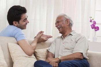 Grandson and grandfather talking