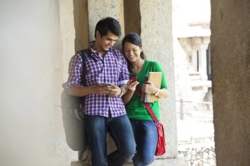 Couple reading an sms on a mobile phone