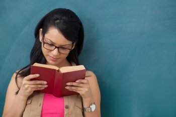 Female college student reading a book