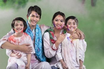 Family posing after playing holi 