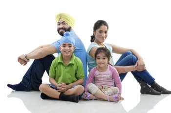 Sikh family sitting together 