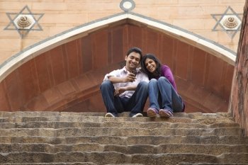 Couple sitting on the steps of Humanyuns Tomb 