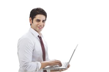 Portrait of young businessman using laptop on white background 